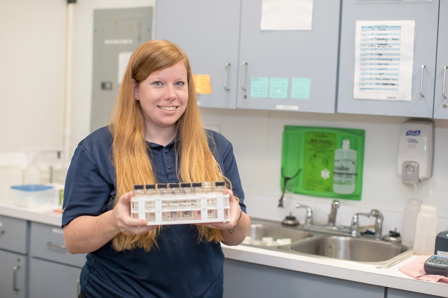 Water Quality volunteer with water tube samples