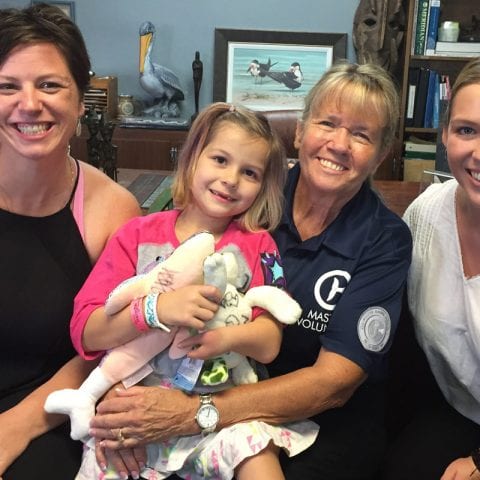 Layla Welch with her mother and inspire team volunteers in Dr. Clay's office