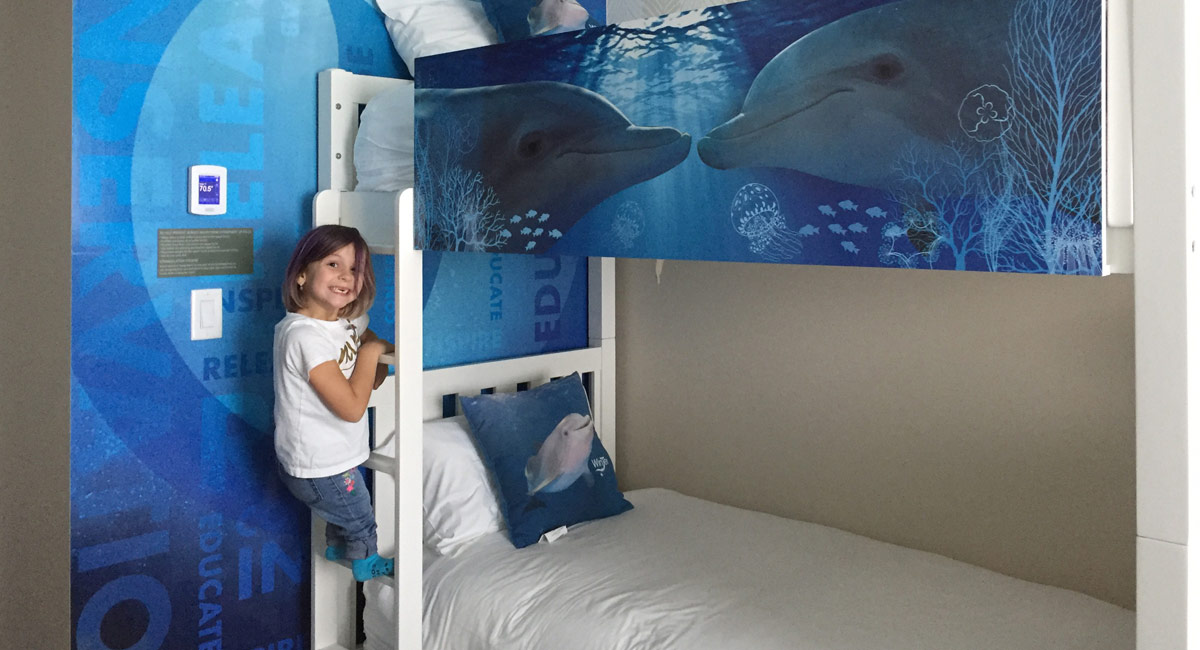 seven-year-old at Winter and Hope themed dolphin room at Wyndham Grand Clearwater Beach.