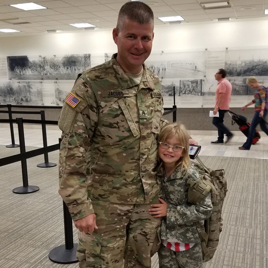 army dad with daughter at airport