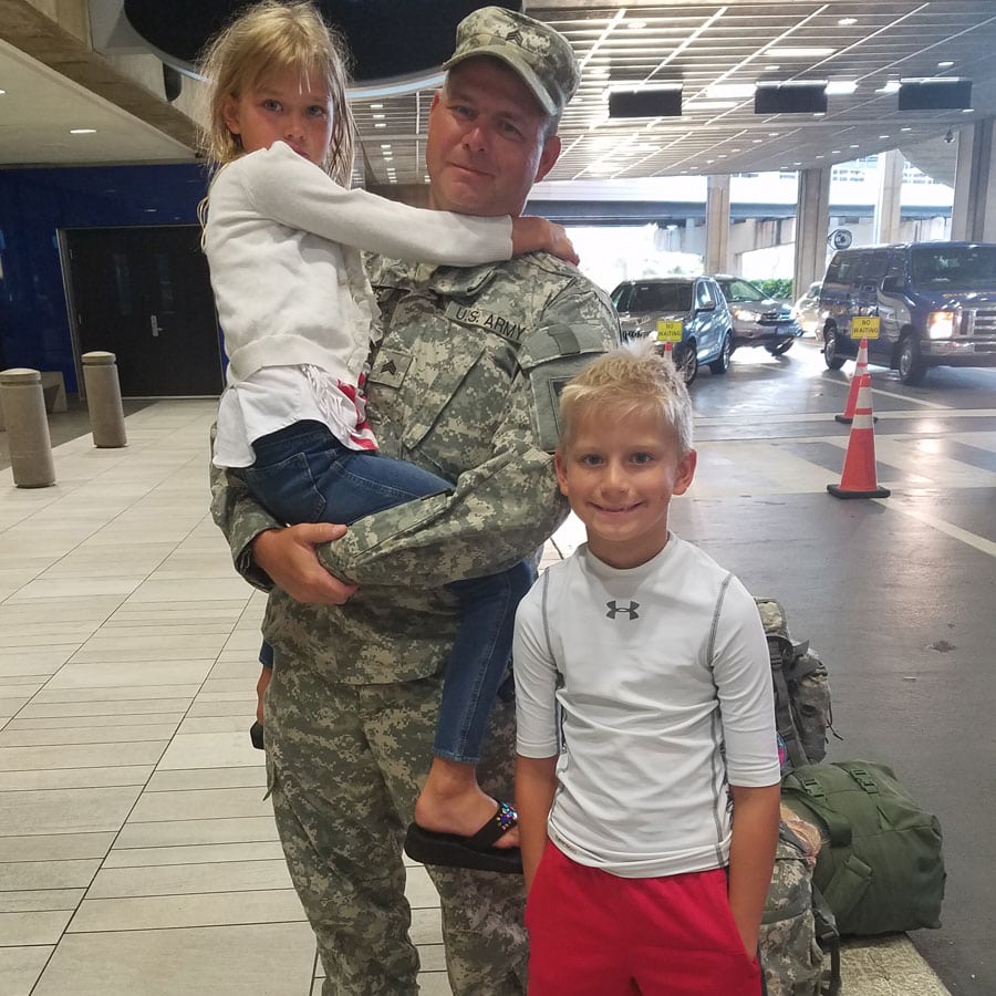 army family at airport