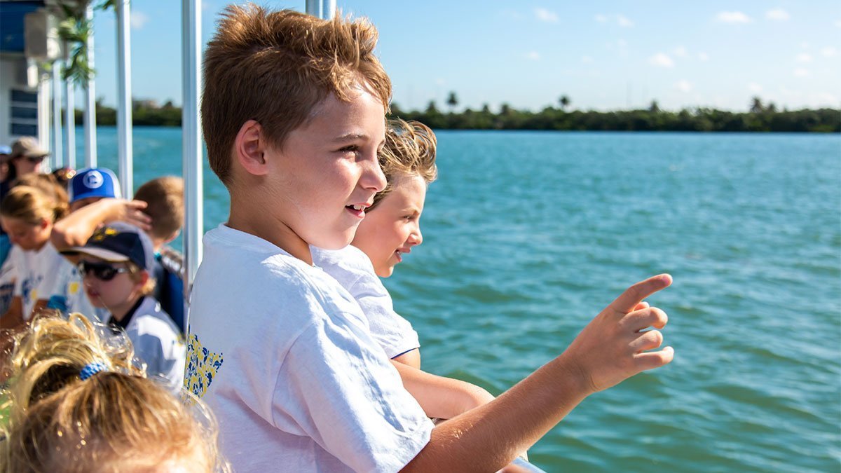 camp kids on boat tour