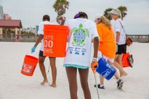 Group cleaning up the beach during Sea Turtle Awareness Day