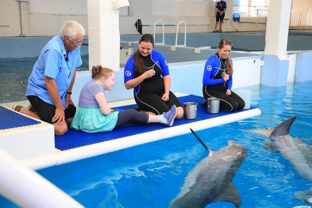 Jim and Grace Savage with dolphins