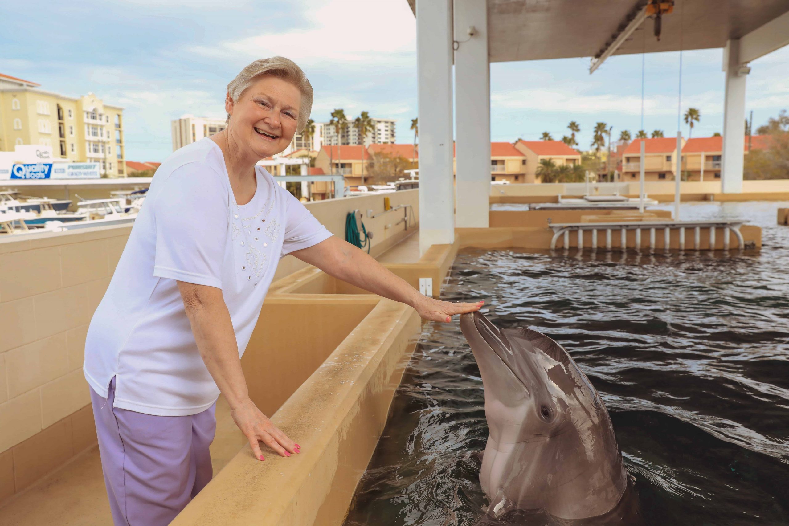 Woman Interacting with Nicholas the Dolphin