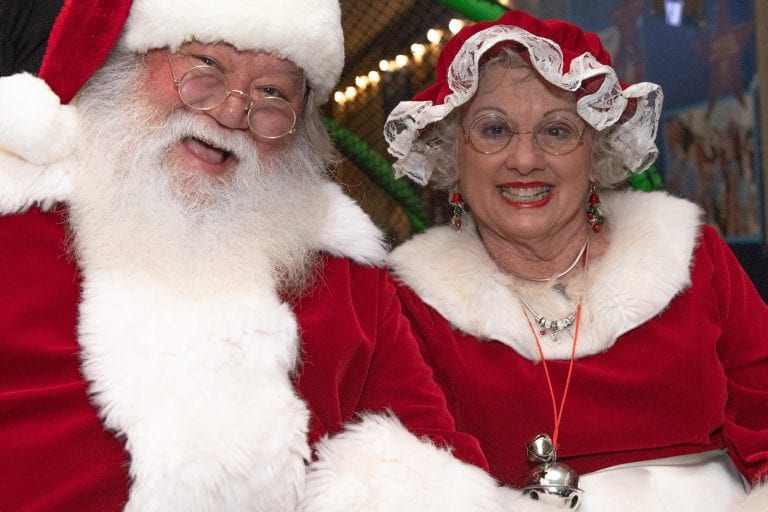 Santa and Mrs. Clause smiling